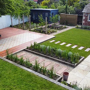 a backyard with a lawn and a small garden