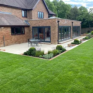 a house with a large lawn in front of it