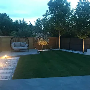 a backyard with a couch and a fire pit