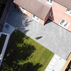 an aerial view of a house with a large yard