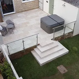 a patio with steps leading up to a door